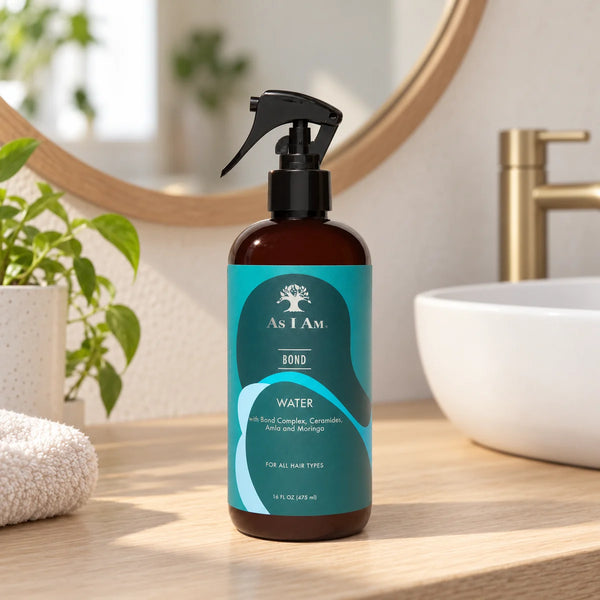 As I Am Bond Water Strengthening Hydration for Damaged Hair — 475 ml on a bathroom vanity.