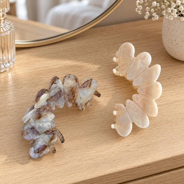 Reverie Hair Bloom Clip — Bloom hair clips, cream and grey Set of 2, on a dressing table.