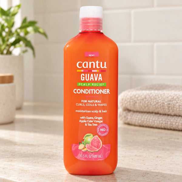 Cantu Guava Conditioner — 13.5 oz on a bathroom vanity.
