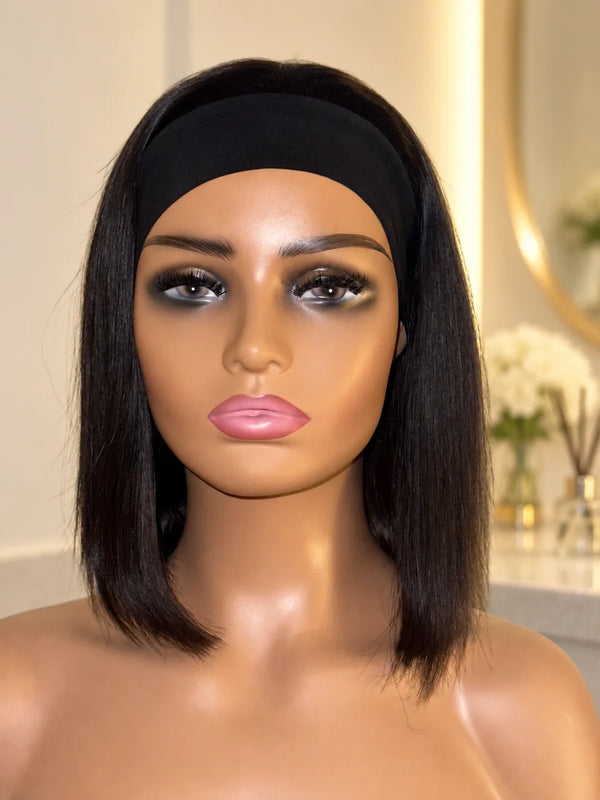 Chic Luxe Hair Glueless Headband Straight Short Bob Wig — Natural, shown on its original subject against a neutral dressing-room background.