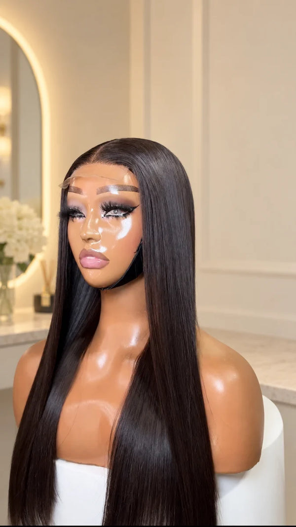 Chic Luxe Hair Bone Straight Bob Wig, shown on its original subject against a neutral dressing-room background.