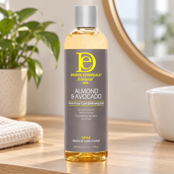 Design Essentials Almond & Avocado Anti-Frizz Curl Defining Gel — 12 oz on a bathroom vanity.