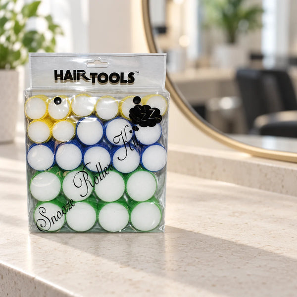 Hair Tools Snooze Roller Kit — Snooze Roller Kit containing 24 yellow, blue and green rollers on a salon counter.