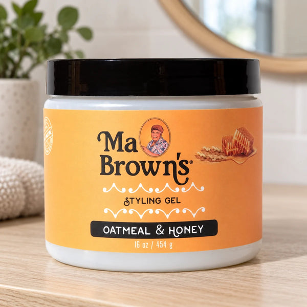 Ma Brown's Styling Gel: Strong Hold & Frizz Control for All Hair Types — 16 oz on a bathroom vanity.