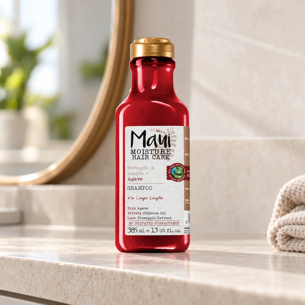 Maui Moisture Strength & Length + Agave Shampoo — 385 ml on a bathroom vanity.