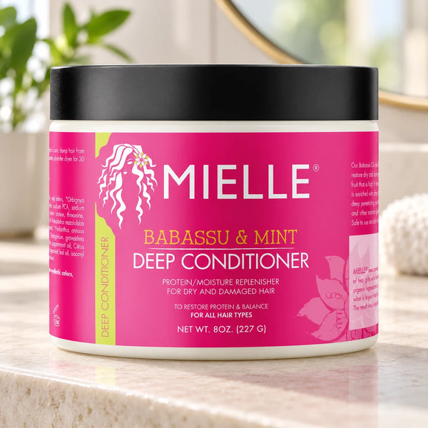 Mielle Babassu & Mint Deep Conditioner — 8 oz on a bathroom vanity.