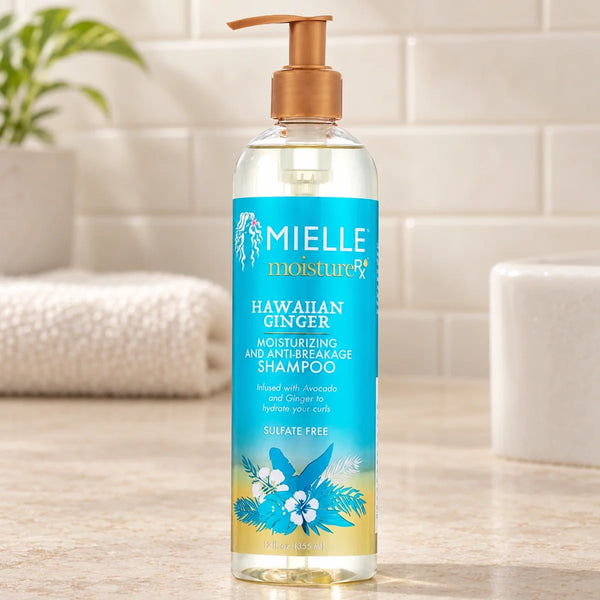 Mielle Hawaiian Ginger Anti-Breakage Shampoo — 12 oz on a bathroom vanity.