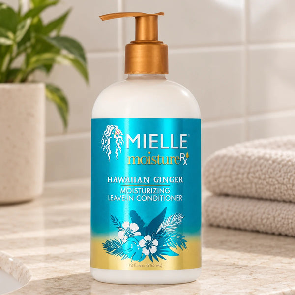 Mielle Hawaiian Ginger Leave-In Conditioner — 12 oz on a bathroom vanity.