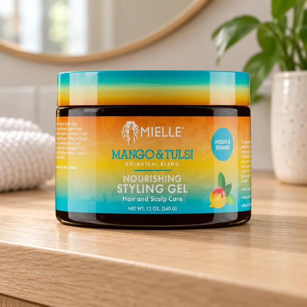 Mielle Mango & Tulsi Nourishing Styling hair Gel — 12 oz on a bathroom vanity.