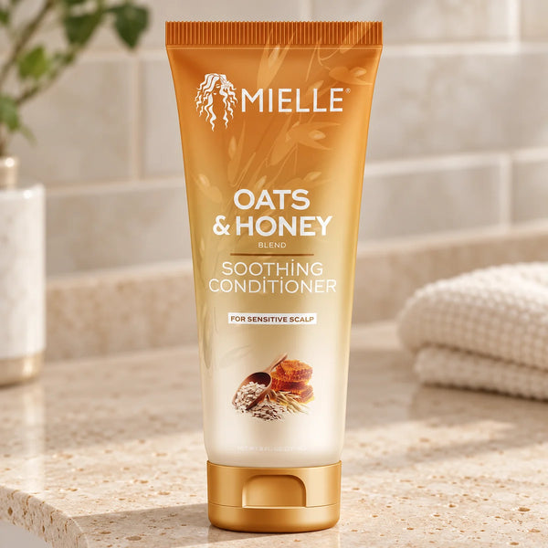 Mielle Oats & Honey Soothing Conditioner — 8 oz on a bathroom vanity.