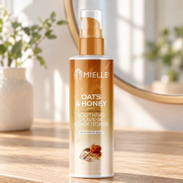 Mielle Oats & Honey Soothing Leave-In Conditioner — 6 oz on a bathroom vanity.