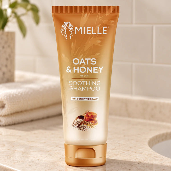 Mielle Oats & Honey Soothing Shampoo — 8 oz on a bathroom vanity.