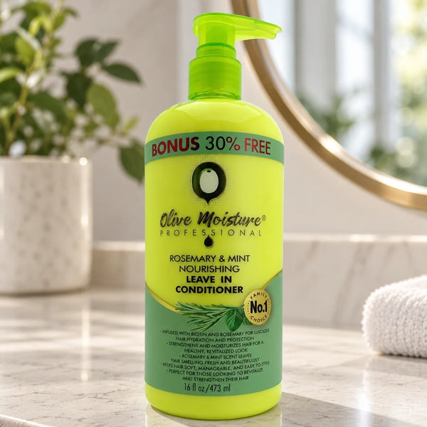 Olive Moisture Rosemary & Mint Nourishing Leave-In Conditioner for Hydrated, Stronger Hair — 16 oz on a bathroom vanity.