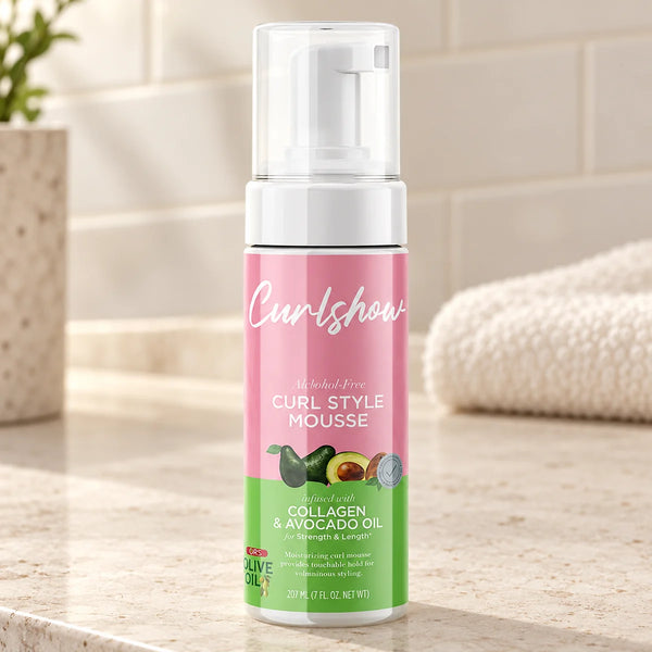 ORS Olive Oil Curlshow Curl Style Mousse 7 oz | Volume & Touchable Hold — 7 oz on a bathroom vanity.