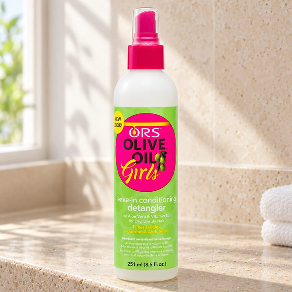 ORS Olive Oil Girls Leave-In Detangler 8.5 oz For Easy Combing — 8.5 oz on a bathroom vanity or dressing table.