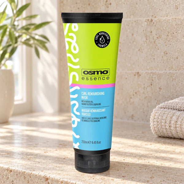 OSMO Essence Renourishing Curl Mask Deep Hydration & Frizz Control for Wavy & Curly Hair — 250 ml on a bathroom vanity or dressing table.