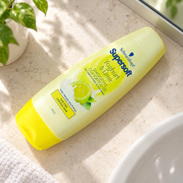 Schwarzkopf Supersoft Yoghurt & Lime Smoothie Conditioner - Nourishing & Revitalising for Soft, Healthy Hair - — 300 ml on a bathroom vanity.