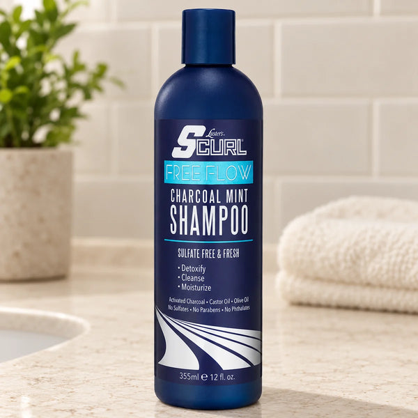 SCurl Free Flow Charcoal Mint Shampoo — 12 oz on a bathroom vanity.