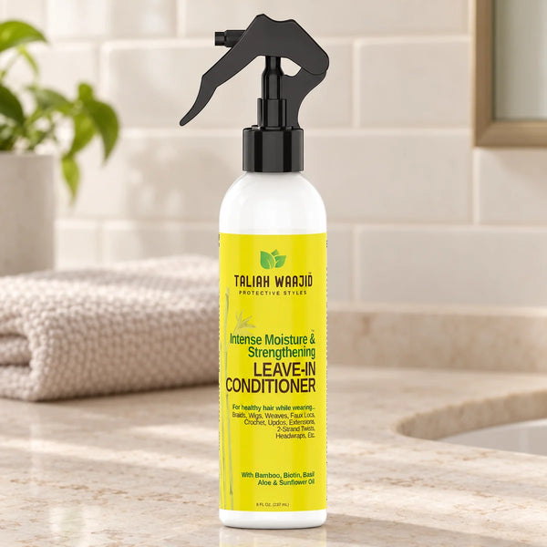 Taliah Waajid Protective Styles Strengthening & Nourishing Leave-in Conditioner for Healthy Hair — 8 oz on a bathroom vanity.