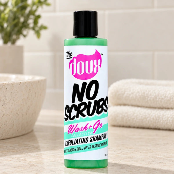The Doux No Scrubs Exfoliating Shampoo 8oz Cleansing & Moisturising — 8 oz on a bathroom vanity.