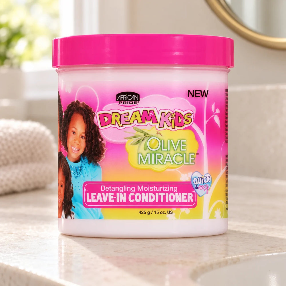 African Pride Dream Kids Leave-In Conditioner — 15 oz on a bathroom vanity.
