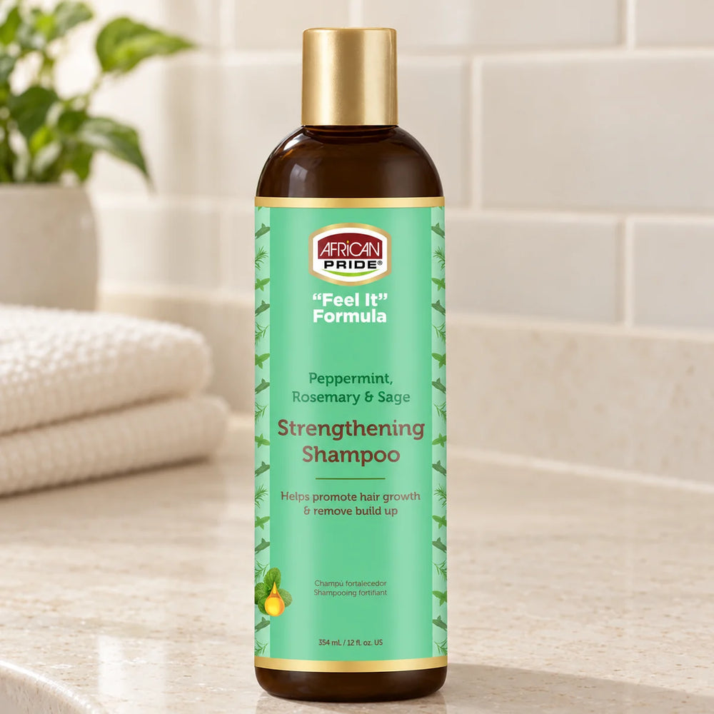 African Pride Peppermint, Rosemary & Sage Strengthening Shampoo — 12 oz on a bathroom vanity.