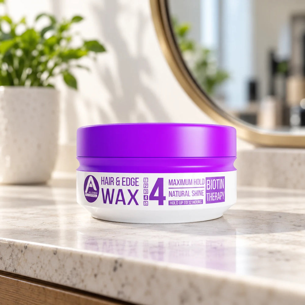 Allored Professional Biotin Therapy Hair & Edge Wax — 150 ml on a bathroom vanity.