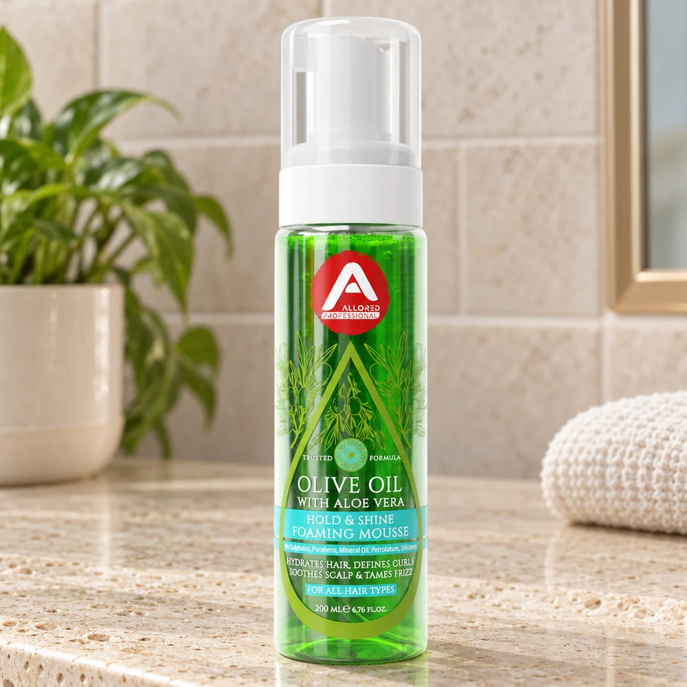 Allored Professional Olive Oil & Aloe Vera Foaming Mousse for Curly, Coily & Wavy Hair — 200 ml on a bathroom vanity.