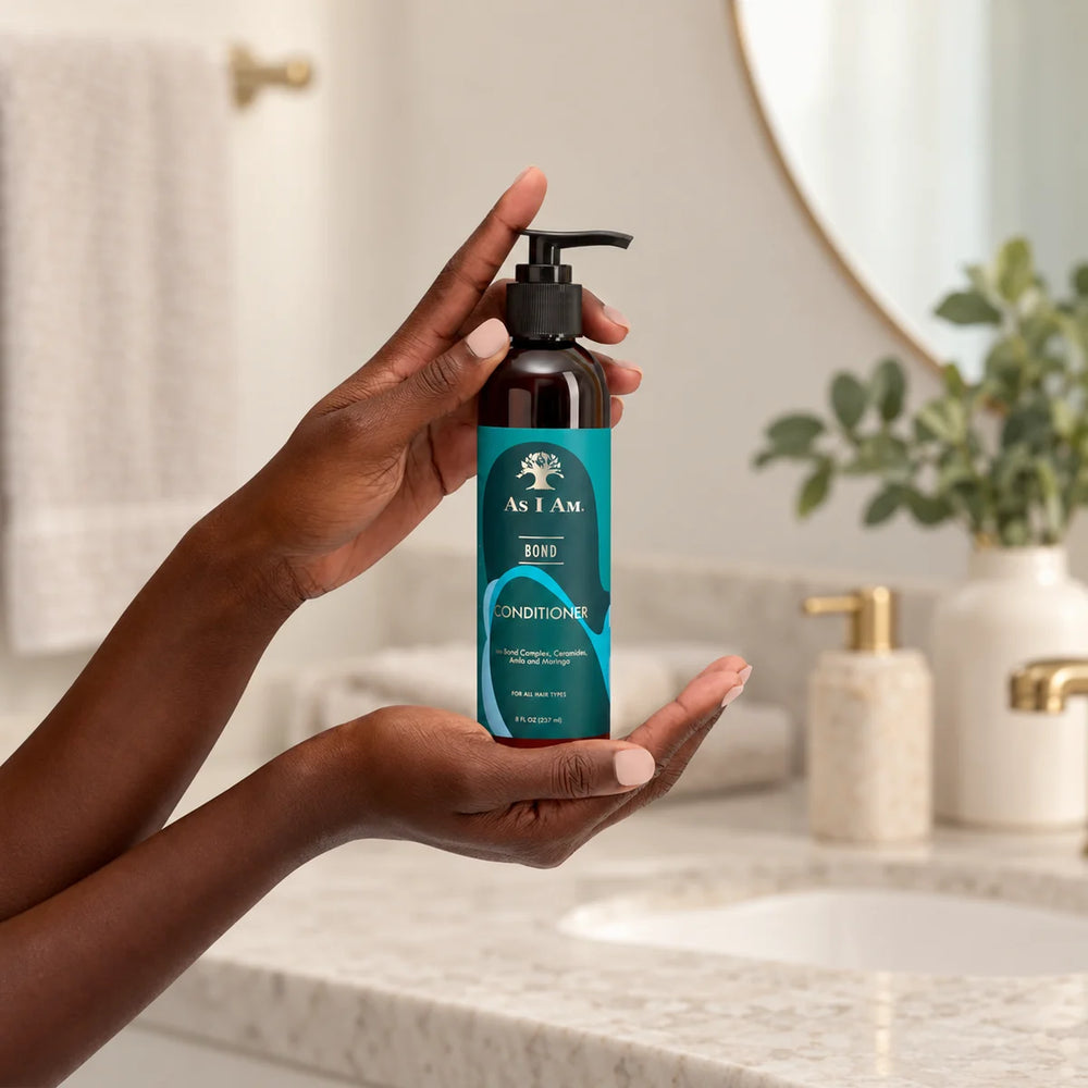 As I Am Bond Conditioner — 237 ml on a bathroom vanity.