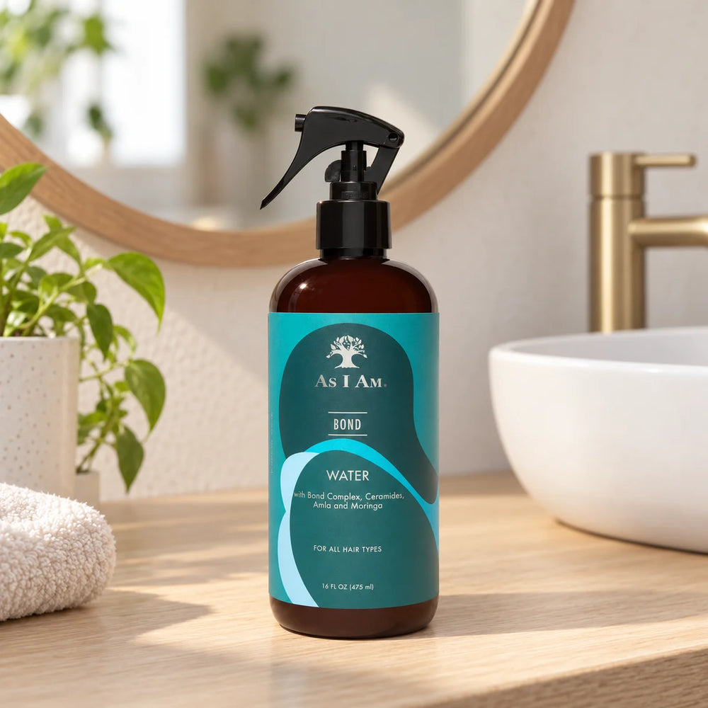 As I Am Bond Water Strengthening Hydration for Damaged Hair — 475 ml on a bathroom vanity.