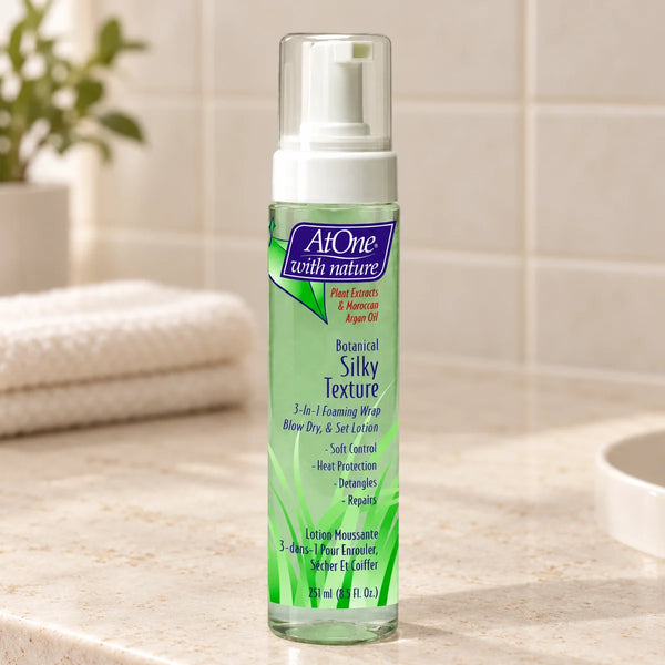 AtOne With Nature Silky Texture Mousse — 8.5 oz on a bathroom vanity.