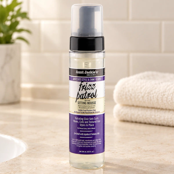 Aunt Jackie's Frizz Patrol Setting Mousse — 8.5 oz on a bathroom vanity.