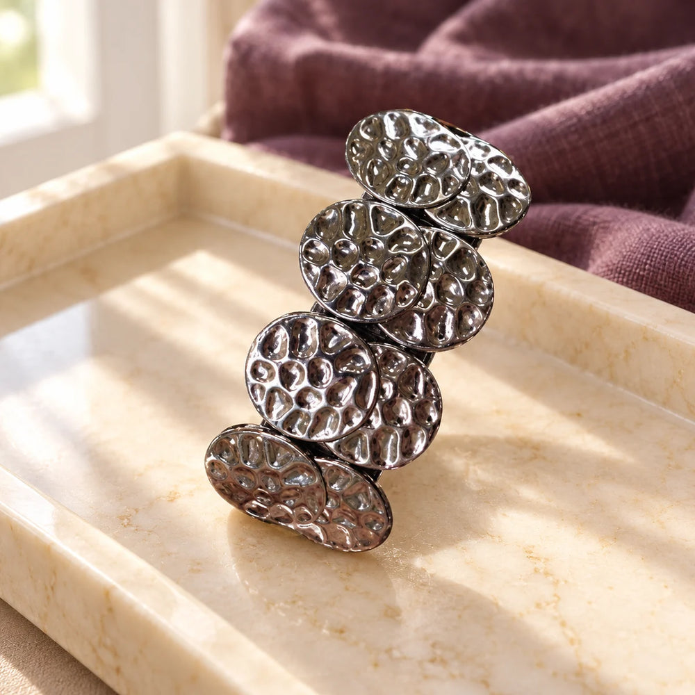 PONY-O Bling Ringz Decorative Covers — Gun Metal Coin on a dressing-table tray.