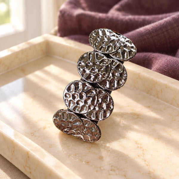 PONY-O Bling Ringz Decorative Covers — Gun Metal Coin on a dressing-table tray.