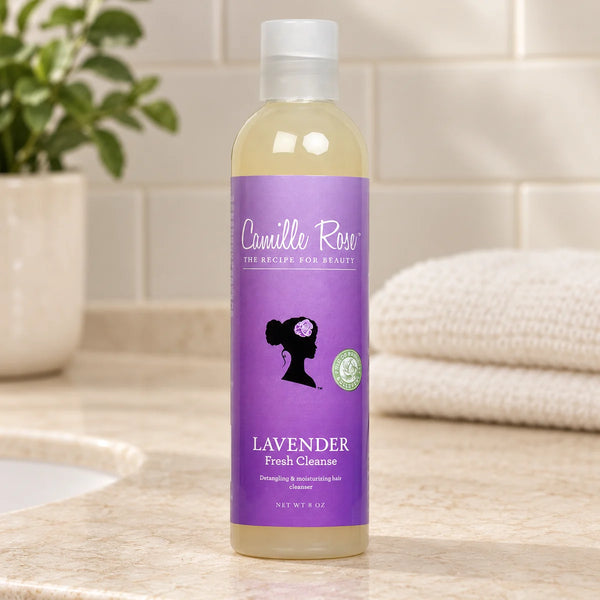 Camille Rose Lavender Fresh Cleanse Soothing Shampoo for Healthy Scalp & Hair — 8 oz on a bathroom vanity.