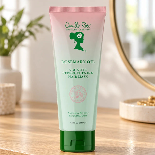 Camille Rose Rosemary Oil 5-Minute Strengthening Hair Mask — 251 ml on a bathroom vanity.