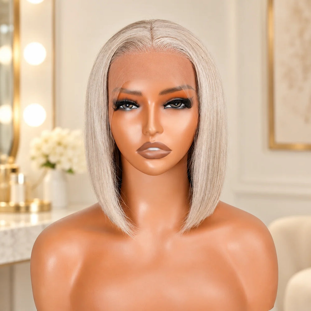 Chic Luxe Hair Lace Coloured Silver Bob Glueless Wig, shown on its original subject against a neutral dressing-room background.