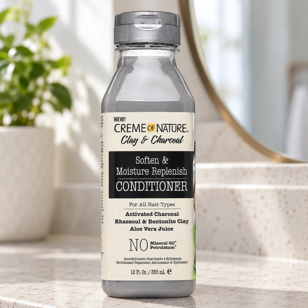 Creme of Nature Clay & Charcoal Conditioner — 12 oz on a bathroom vanity.