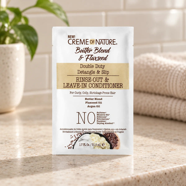 Creme of Nature Double Duty Detangle & Slip Rinse-Out & Leave-In Conditioner — 51.8 ml on a bathroom vanity.