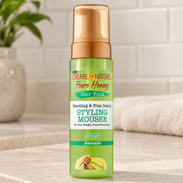 Creme of Nature Pure Honey Hair Food Styling Mousse — 7 oz on a bathroom vanity.