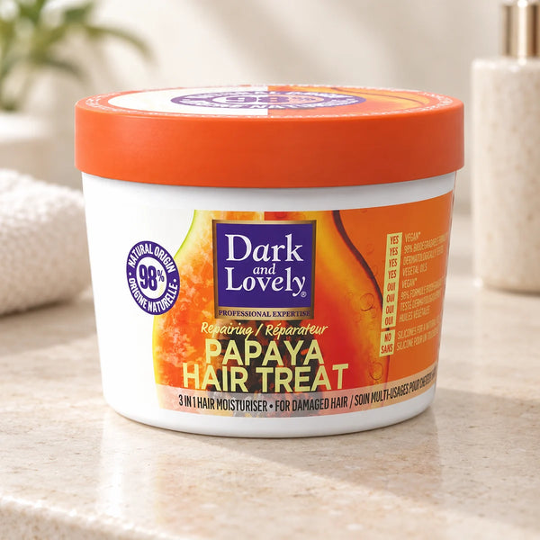Dark & Lovely Papaya Hair Treat 13oz Damage Repair Hair Mask — 13 oz on a bathroom vanity or dressing table.