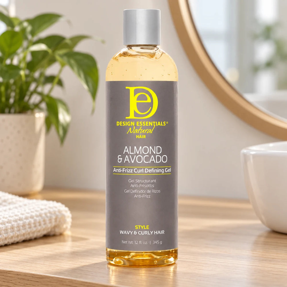 Design Essentials Almond & Avocado Anti-Frizz Curl Defining Gel — 12 oz on a bathroom vanity.