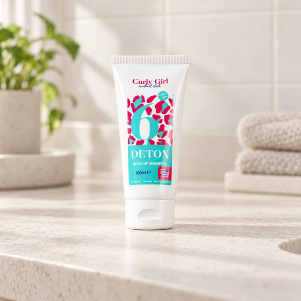 Detox shampoo 100ml tube on a bathroom vanity.
