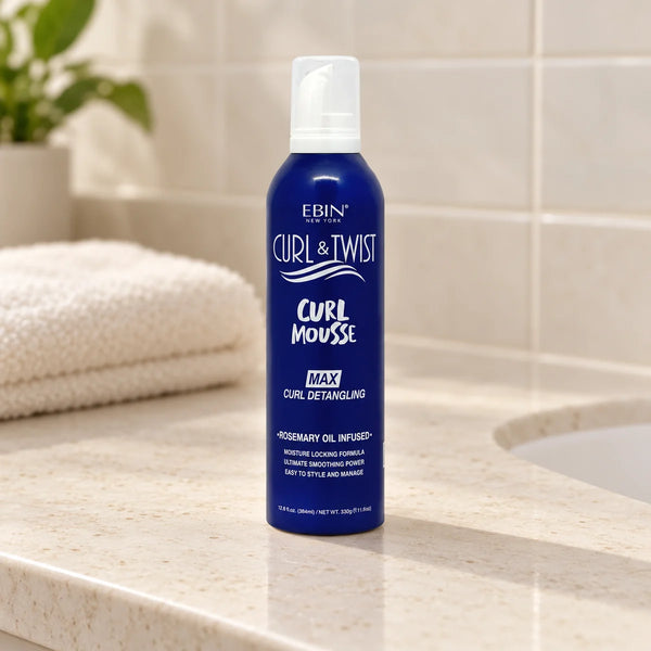 Ebin - Curl & Twist Curl Mousse Max Curl Detangling Rosemary Oil Infused - on a bathroom vanity.
