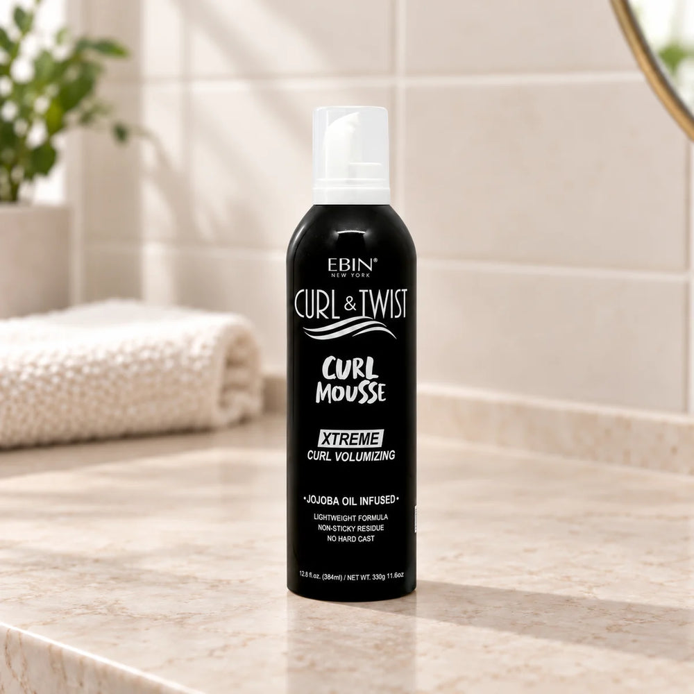 Ebin - Curl & Twist Curl Mousse Xtreme Curl Volumizing Jojoba Oil Infused - on a bathroom vanity.