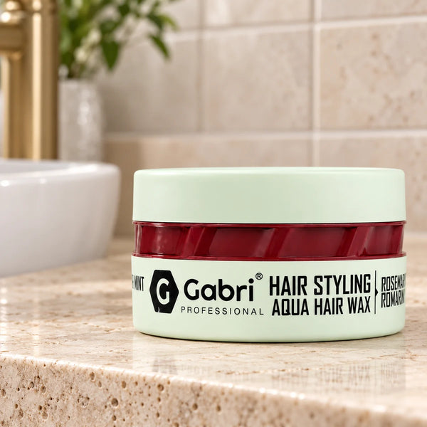 Gabri Professional Hair Styling Aqua Wax Rosemary Mint — 150 ml on a bathroom vanity.