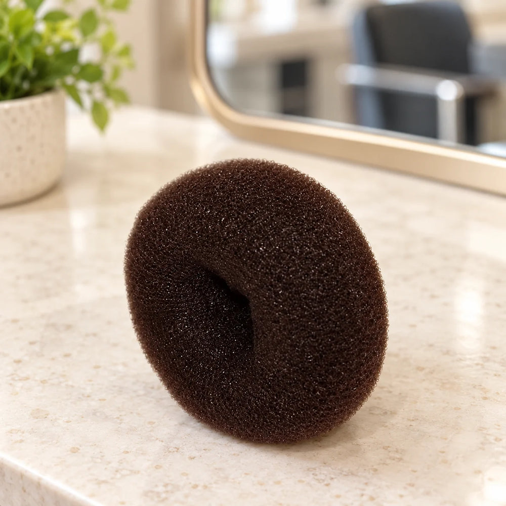Hair Tools Bun Ring - Large — Brown large bun ring on a salon counter.