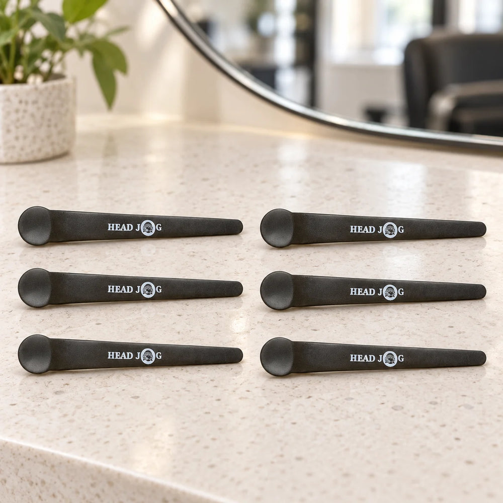 Hair Tools Supa-Klipz — Six Hair Tools Supa-Klipz sectioning clips on a salon counter.