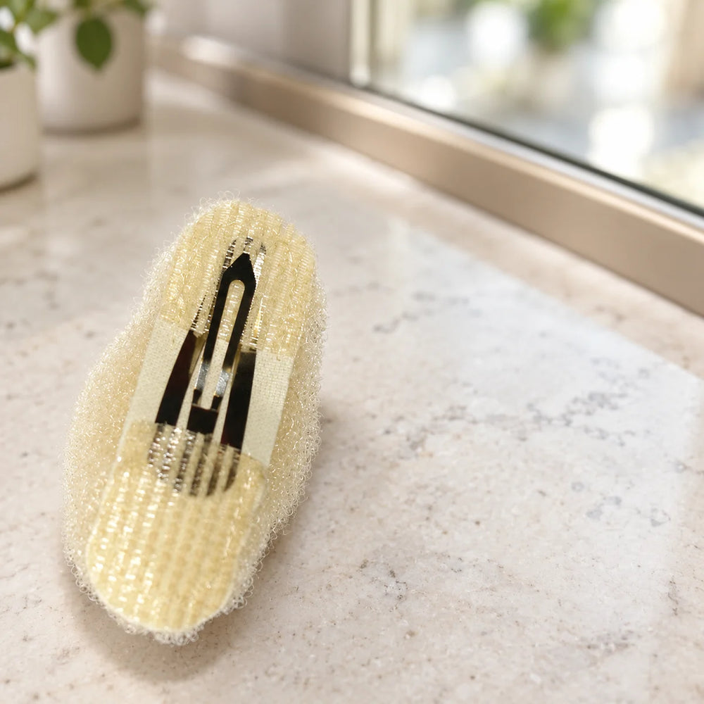 Hair Tools Updo Pad — Light Hair Tools Updo Pad on a salon counter.