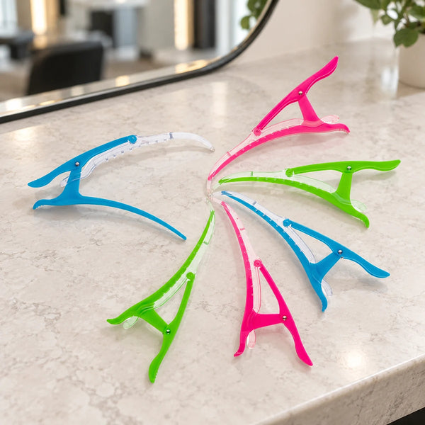 Head Jog Eagle Klipz — Six Head Jog Eagle Klipz, two each in green, blue and pink, on a salon counter.